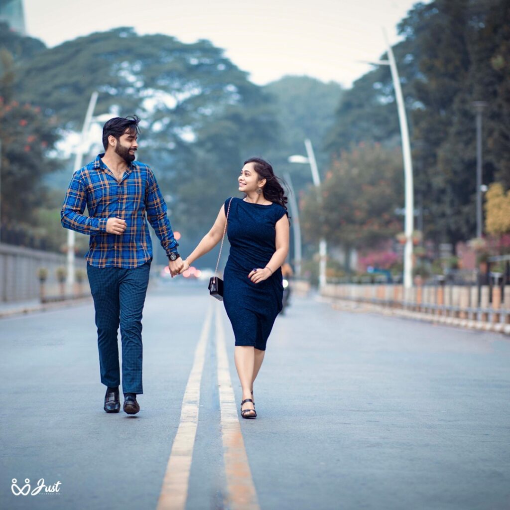 Prewedding couple walkong photo in frong of UB City